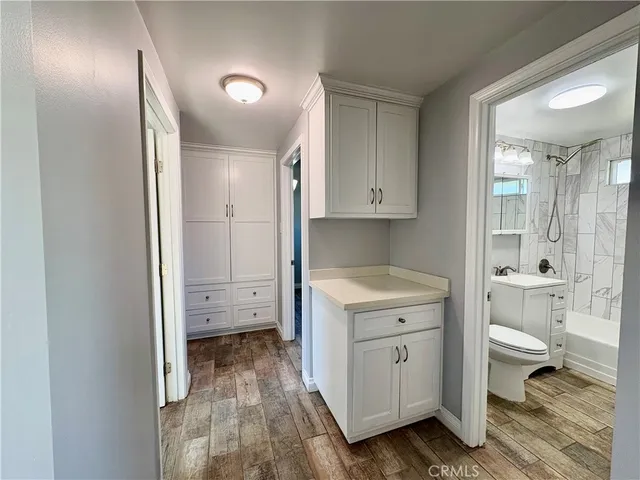 a view of bathroom with a toilet sink and a mirror
