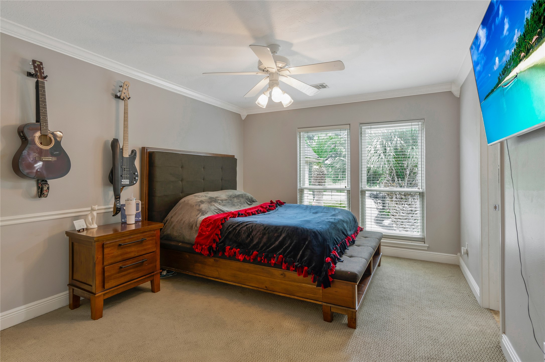 13914 Skinner Road Cypress, TX 77429 - Photo 23 of 50 Spacious secondary bedroom with hardwood floors, a tray ceiling, ceiling fan, and two windows that bring in plenty of natural light.