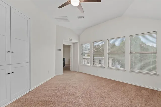 a bathroom with a bathtub next to a window