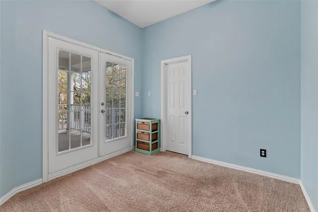 a bedroom with a bed and a window in it