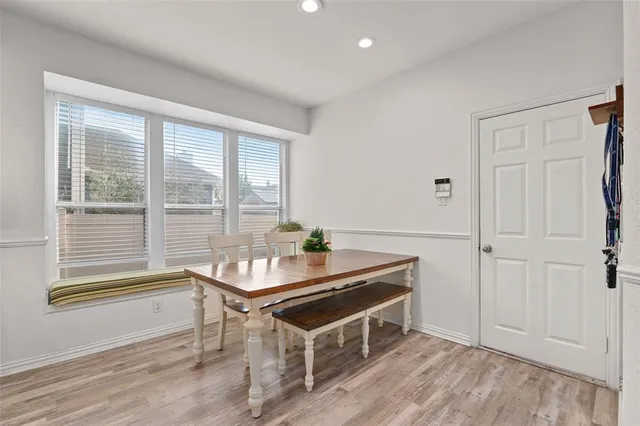 a room with a table and windows