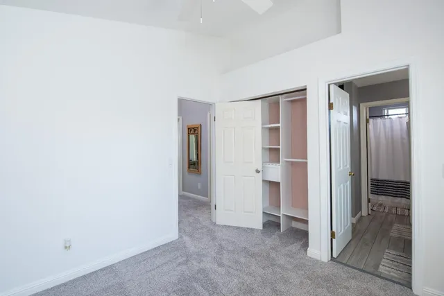 a view of an empty room and closet