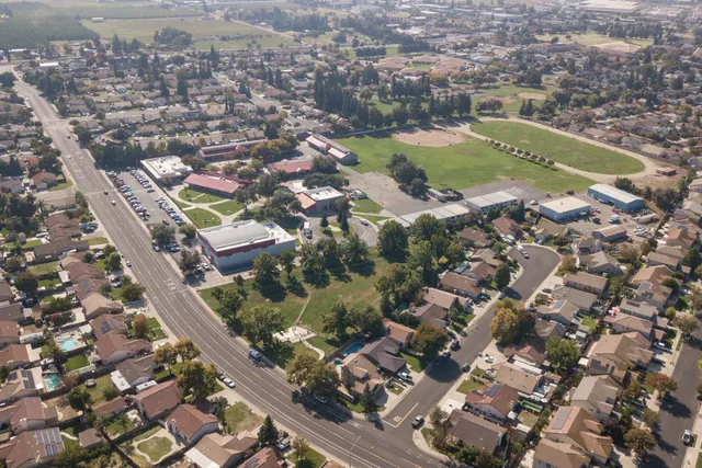 an aerial view of residential houses with outdoor space