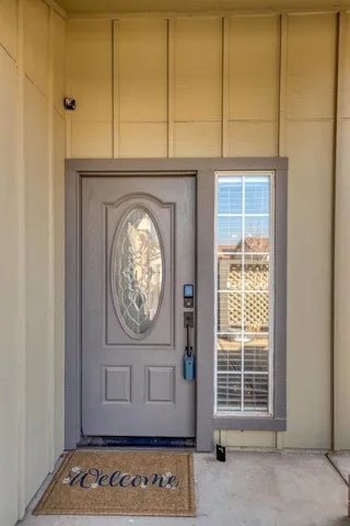 a view of front door with wooden floor