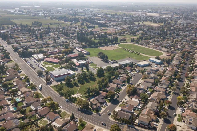 an aerial view of residential houses with outdoor space