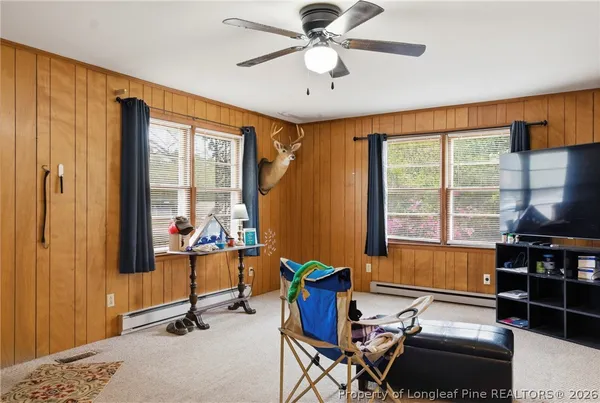 a view of a big room with windows chandelier