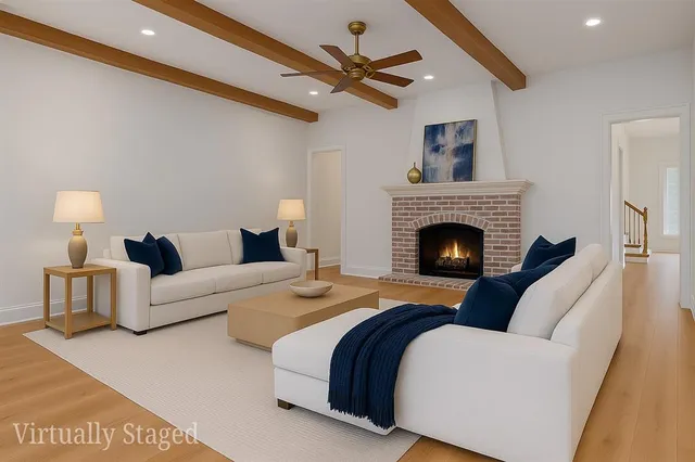 a view of a living room a fireplace with wooden floor and a large window