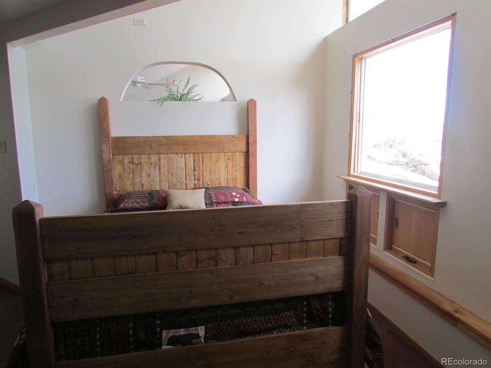 5410 Hunt Place Rye, CO 81069 - Photo 11 of 22 a living room with a bed furniture and a window