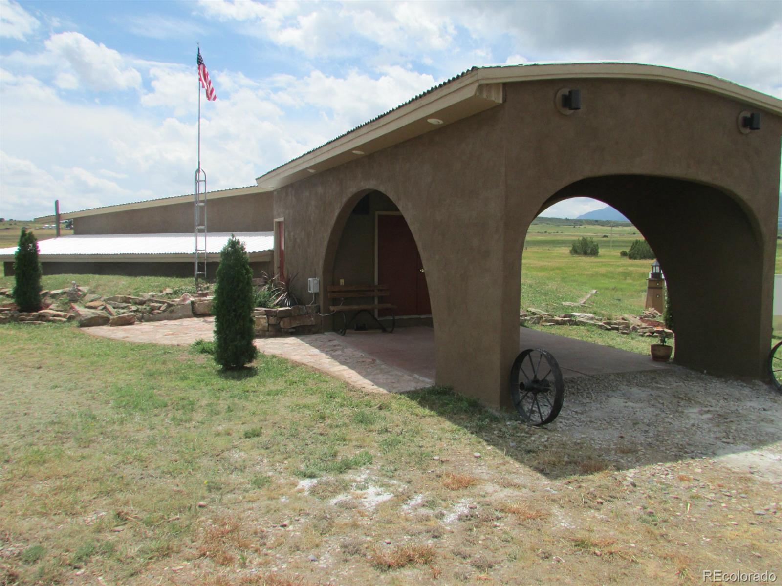 5410 Hunt Place Rye, CO 81069 - Photo 17 of 22 a front view of a house with a yard