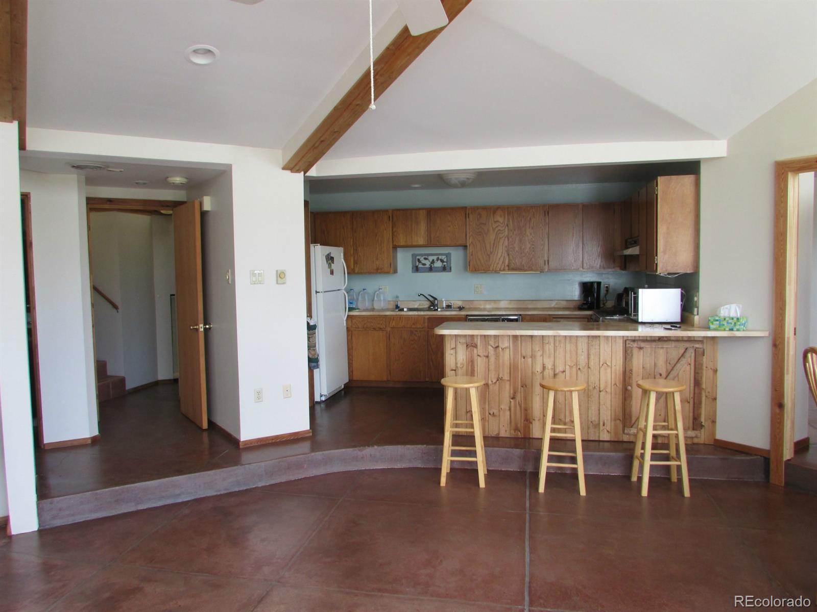 5410 Hunt Place Rye, CO 81069 - Photo 4 of 22 a dining room with furniture and a kitchen view