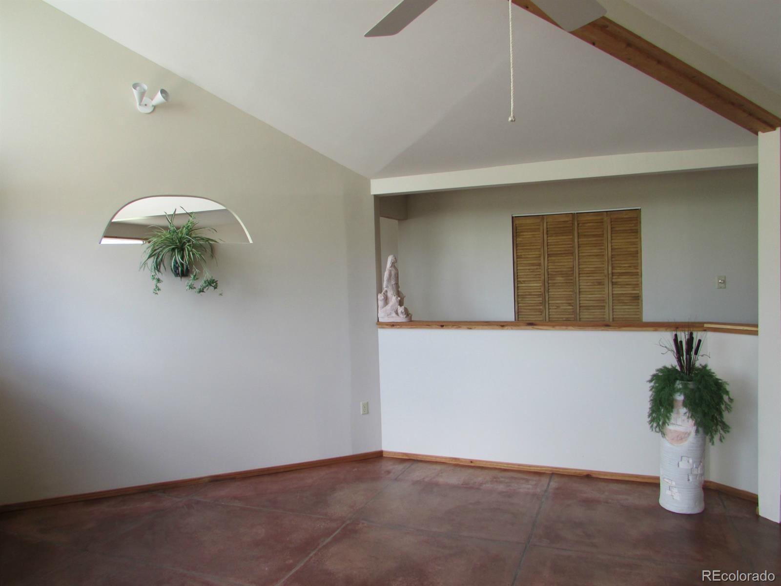 5410 Hunt Place Rye, CO 81069 - Photo 6 of 22 a potted plant sitting on top of a wooden floor