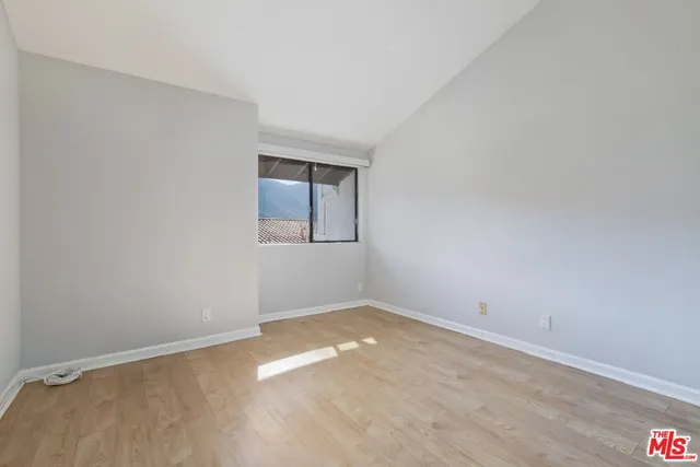 an empty room with a empty space and window