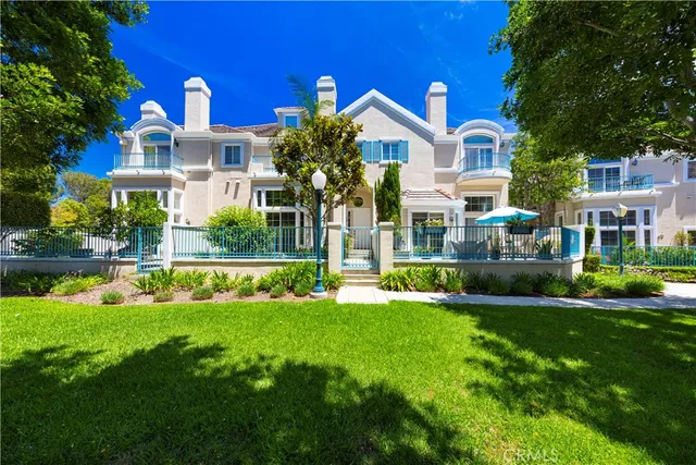 a front view of a house with a yard table and chairs