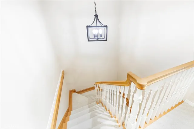a view of a hallway with stairs