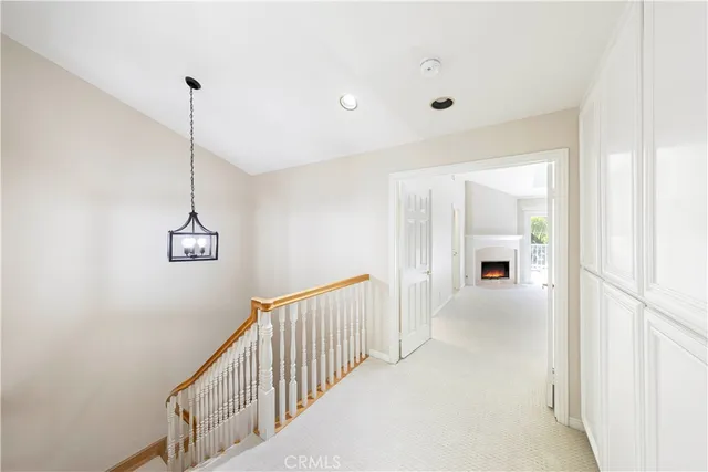 a view of a hallway with windows