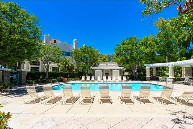 a view of a swimming pool with a lounge chair