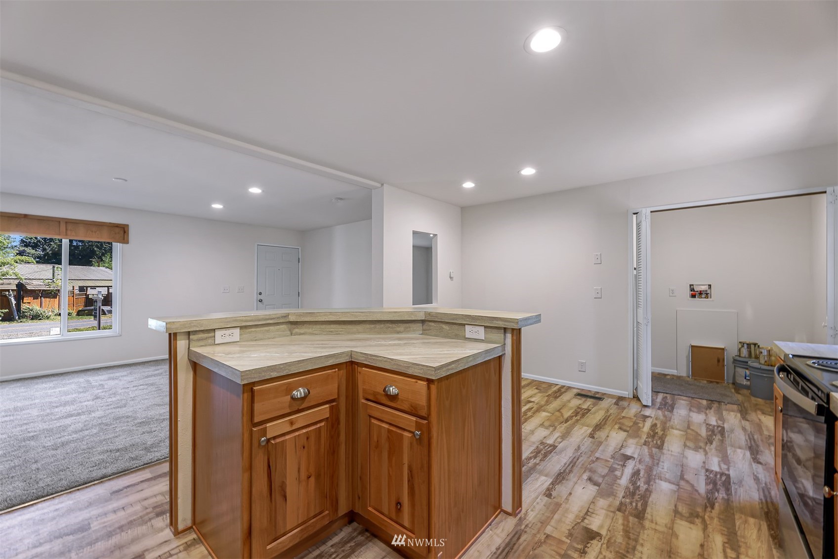 3616 North Red River Road Ferndale, WA 98248 - Photo 12 of 28 a kitchen with a stove and a wooden floor