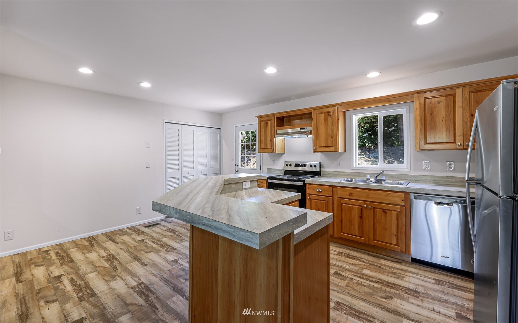 3616 North Red River Road Ferndale, WA 98248 - Photo 14 of 28 a kitchen with granite countertop kitchen island sink stove and refrigerator
