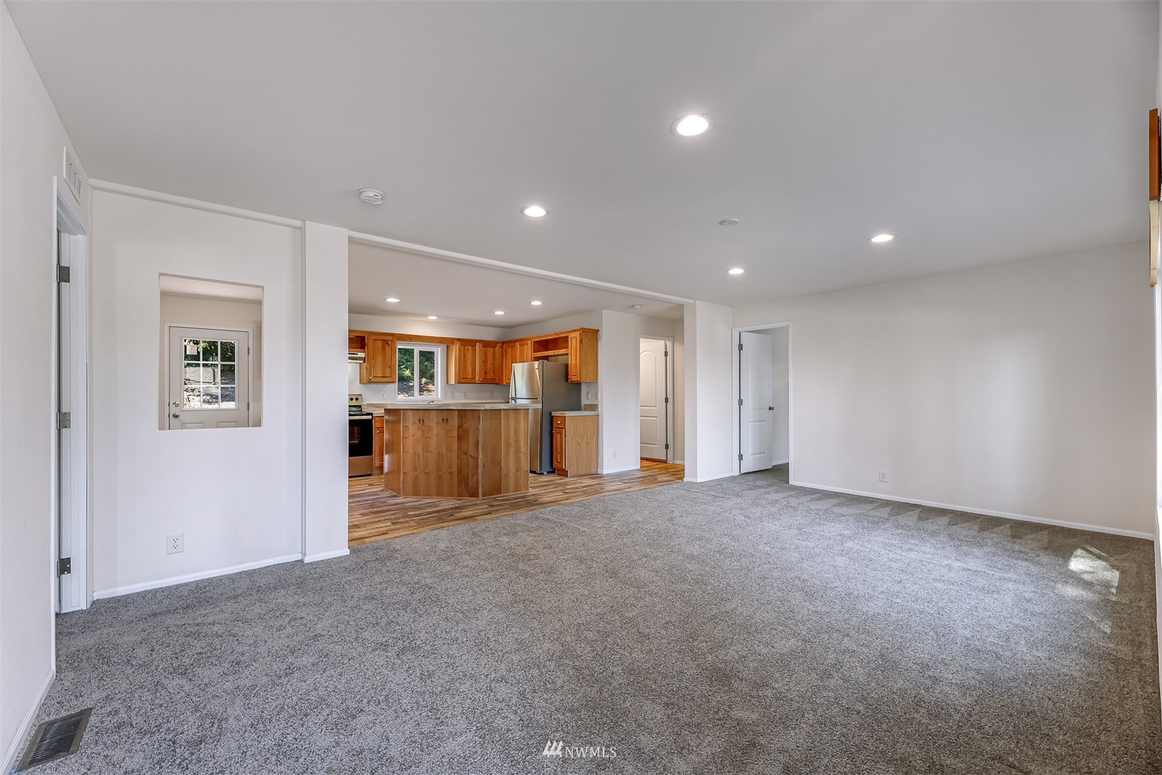 3616 North Red River Road Ferndale, WA 98248 - Photo 3 of 28 a view of an empty room with wooden floor and a window