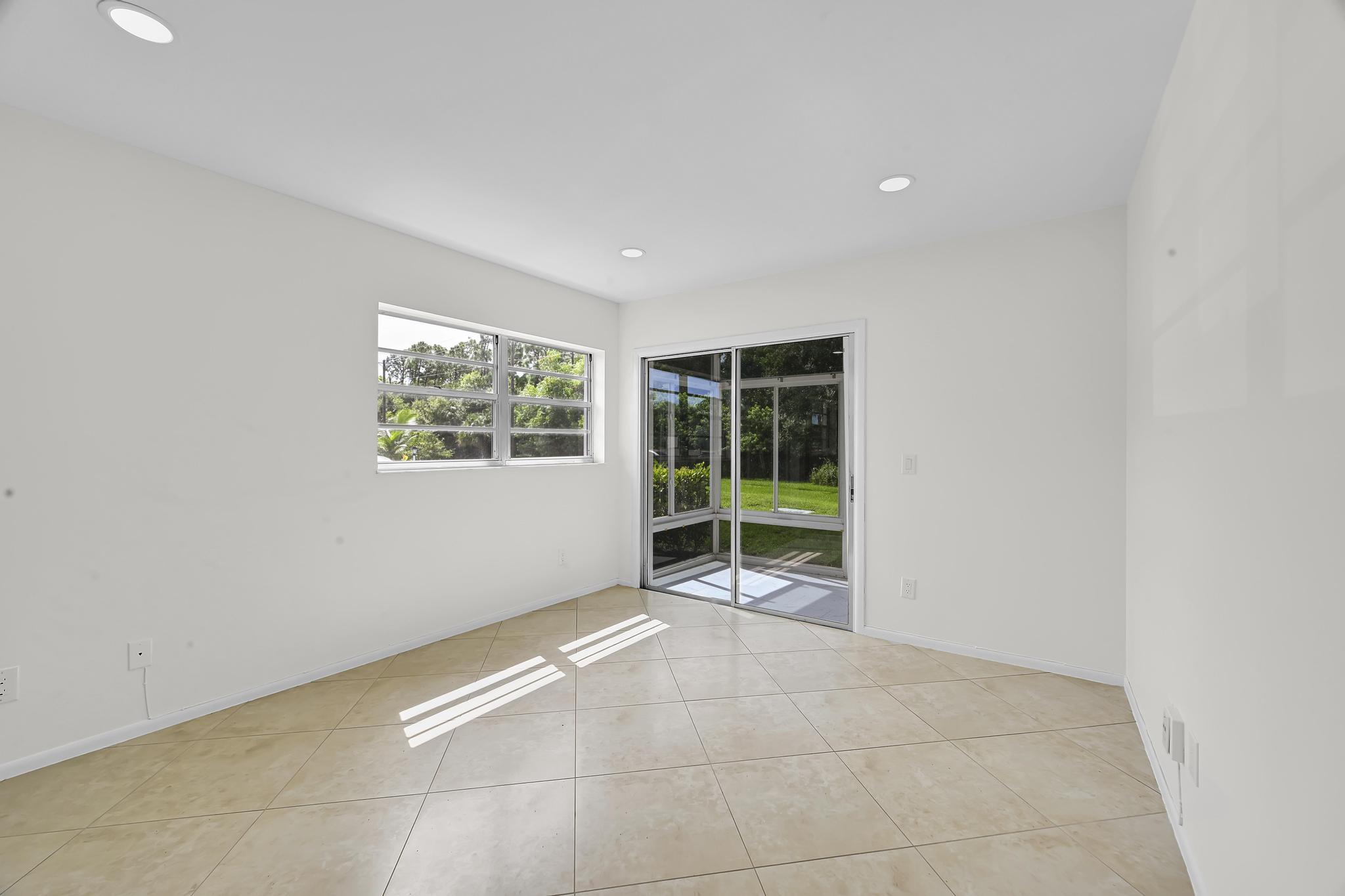 2 Lake Vista Trail, Unit 107 Port St. Lucie, FL 34952 - Photo 12 of 19 a view of an empty room with a window