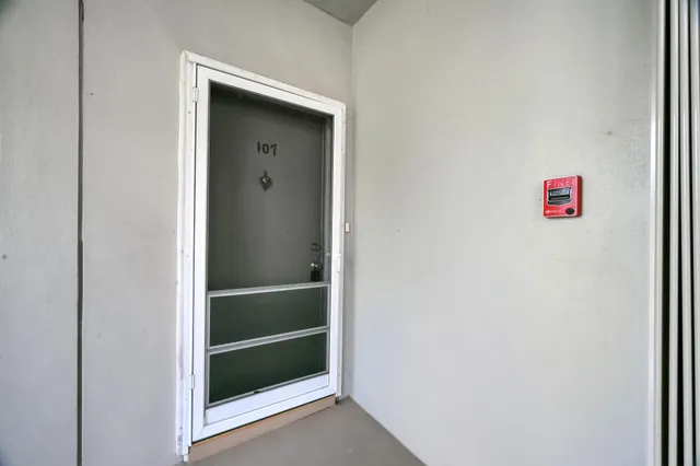 a view of an empty room with a window