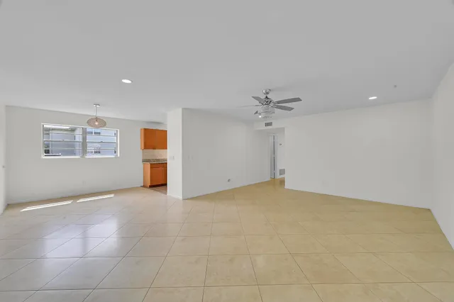 a view of a room with wooden floor and window