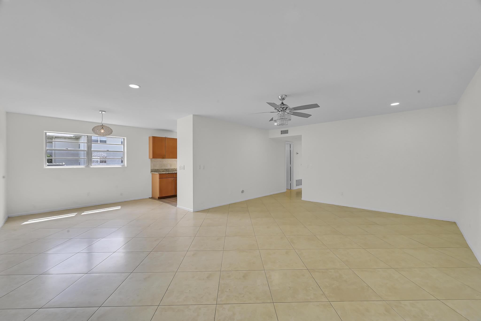 2 Lake Vista Trail, Unit 107 Port St. Lucie, FL 34952 - Photo 4 of 19 a view of an empty room with a window