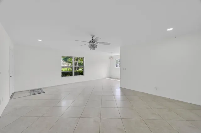 a bathroom with a granite countertop sink a toilet and a bathtub