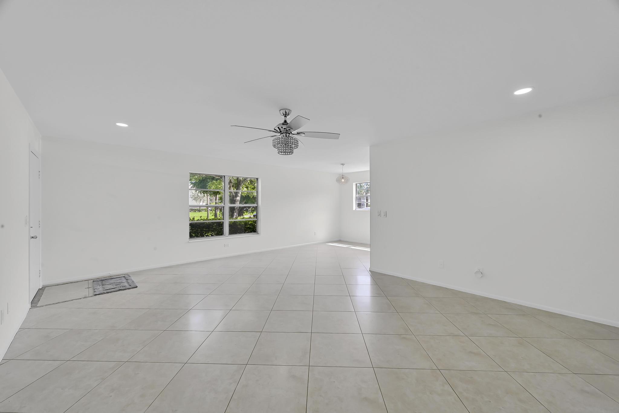 2 Lake Vista Trail, Unit 107 Port St. Lucie, FL 34952 - Photo 10 of 19 a view of an empty room with a window