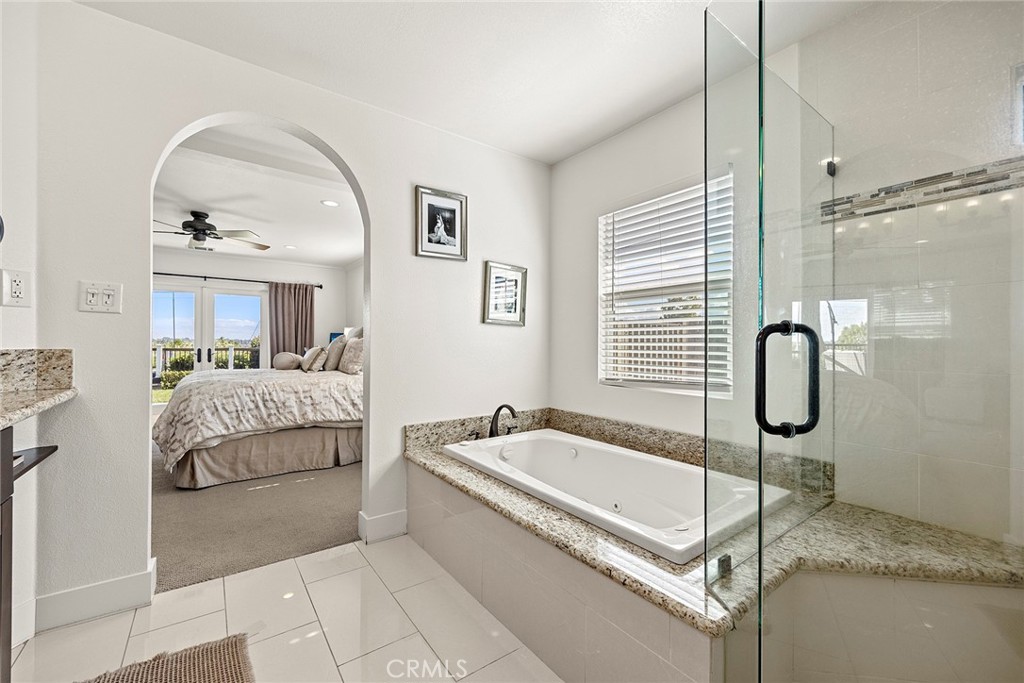 15914 West Road Whittier, CA 90603 - Photo 28 of 47 a spacious bathroom with a tub and a large mirror