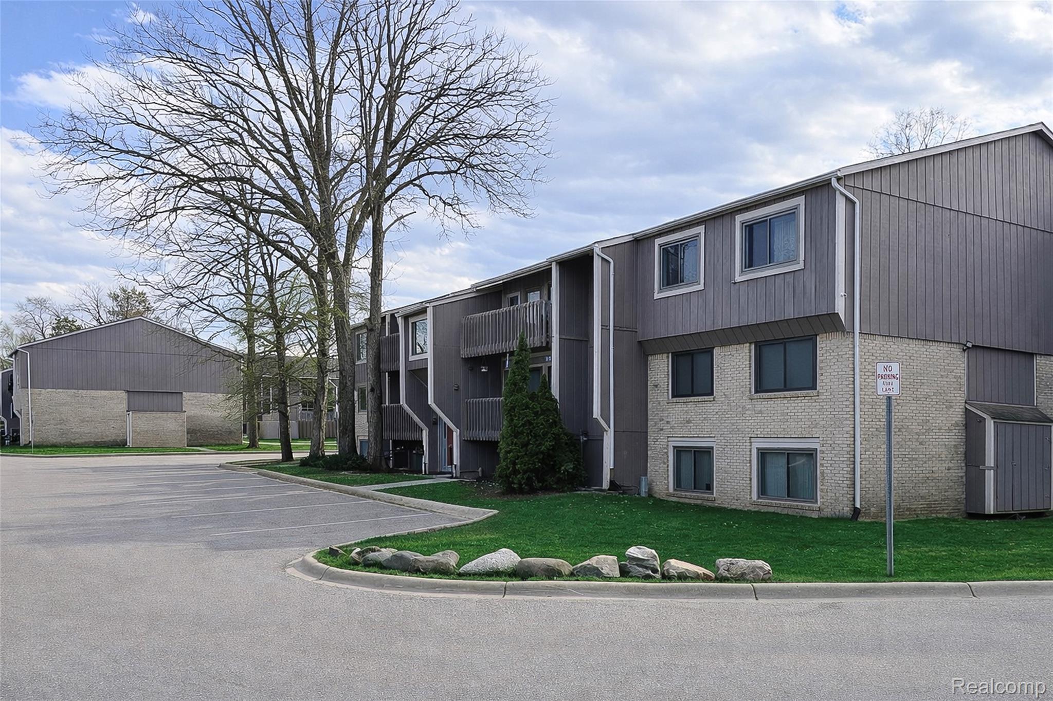 29860 West 12 Mile Road, Unit 604 Farmington, MI 48334 - Photo 1 of 26 View of apartment building / complex with uncovered parking