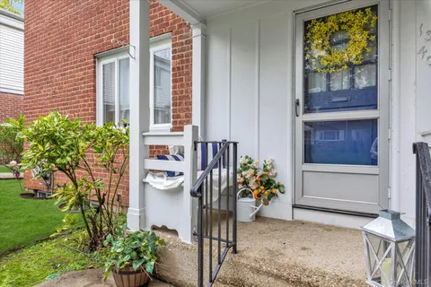 a front view of a house with outdoor seating