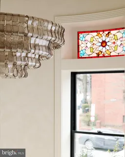 a view of a dining room with furniture and window