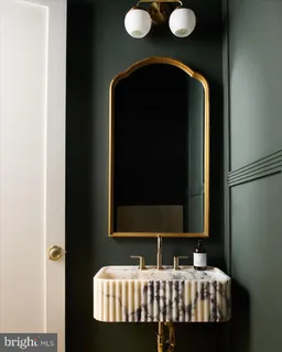 a bathroom with a sink a mirror and shower