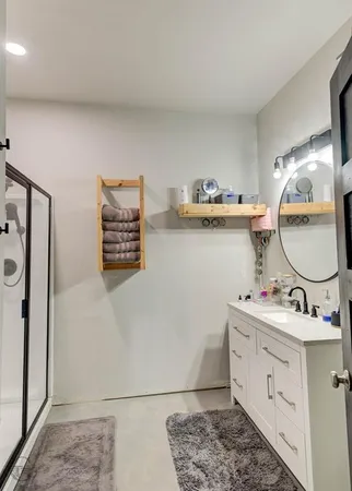 a view of a green field with wooden fence