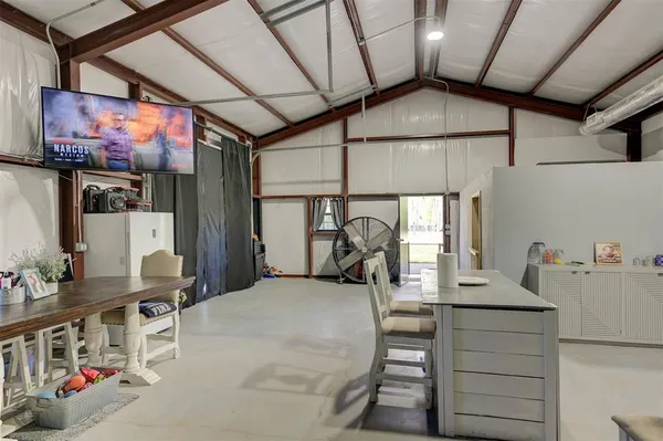 a kitchen with stainless steel appliances kitchen island granite countertop a sink and cabinets