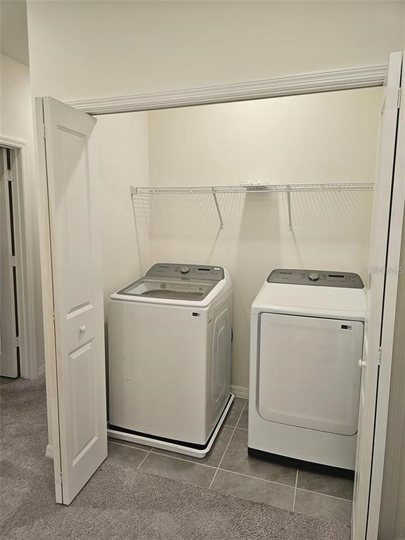 4389 Small Creek Road Kissimmee, FL 34744 - Photo 13 of 17 a utility room with dryer and washer