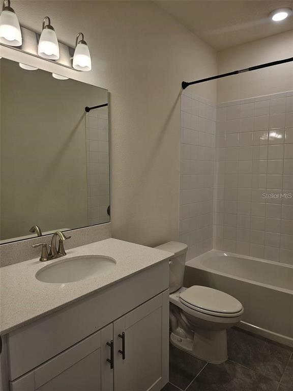 4389 Small Creek Road Kissimmee, FL 34744 - Photo 14 of 17 a bathroom with a sink toilet and shower