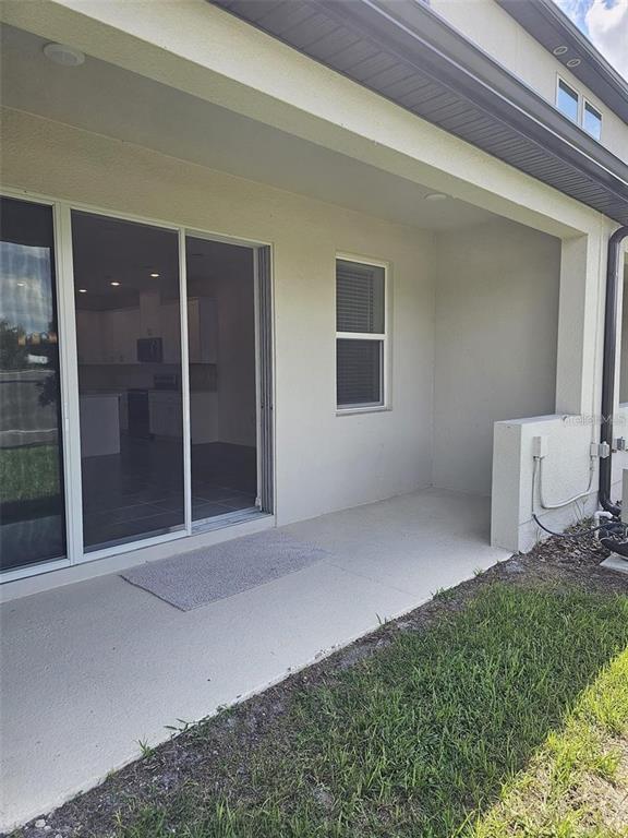 4389 Small Creek Road Kissimmee, FL 34744 - Photo 17 of 17 a view of a house with a backyard