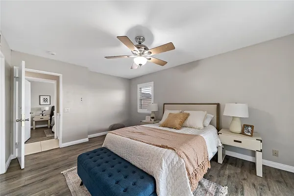 a bedroom with a bed and window