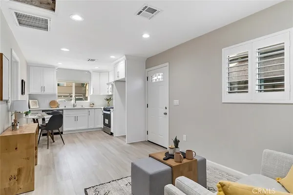a living room with furniture and a table