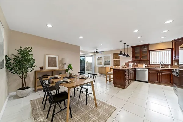 a kitchen with a table and chairs in it