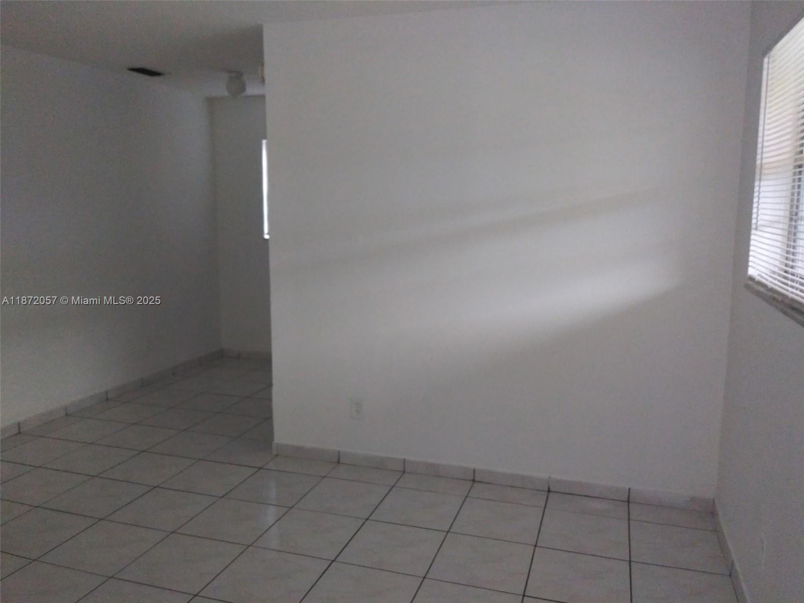 6147 Arthur Street, Unit 1 Hollywood, FL 33024 - Photo 3 of 4 wooden floor in an empty room