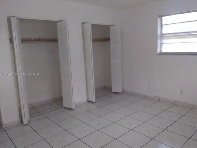 an empty room with white door
