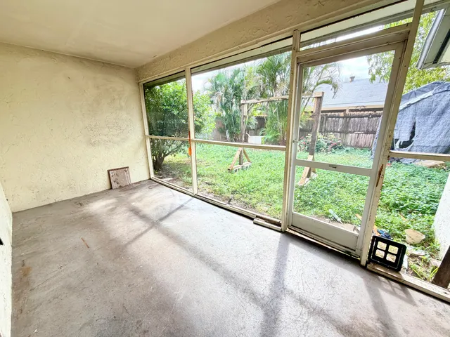 a view of a garden with an outdoor seating