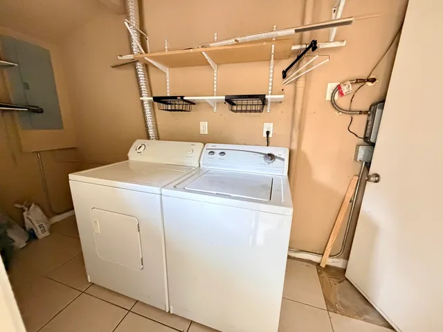 a utility room with dryer and washer