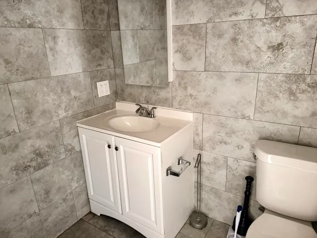 a bathroom with a sink and toilet