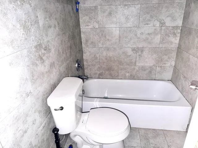 a bathroom with a toilet and a sink