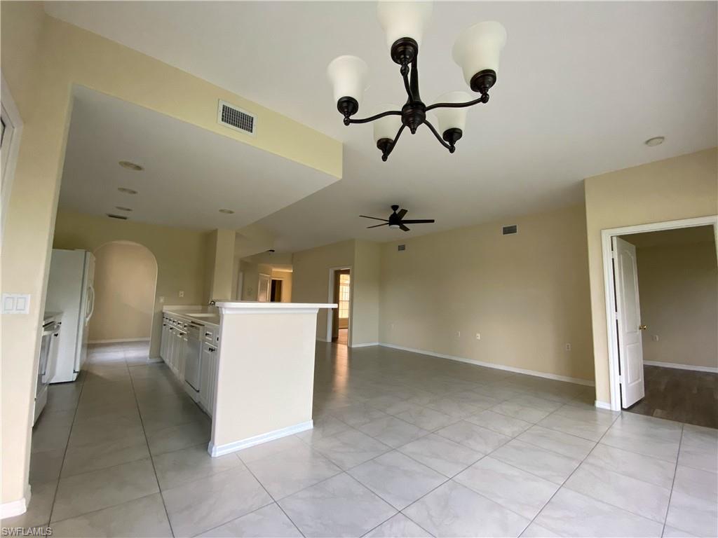 1993 Crestview Way, Unit 129 Naples, FL 34119 - Photo 11 of 26 a view of a room with a washer and dryer