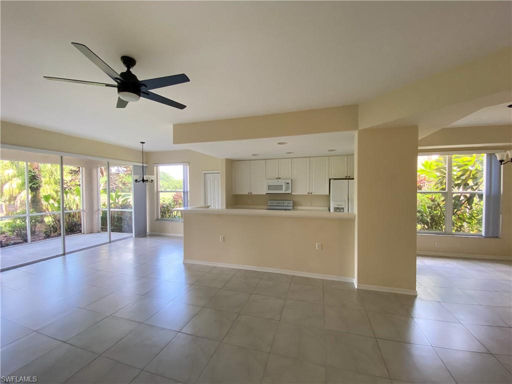 1993 Crestview Way, Unit 129 Naples, FL 34119 - Photo 12 of 26 a view of an empty room with a window